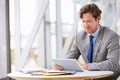 Corporate businessman working with tablet computer