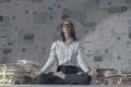 Corporate businesswoman practicing meditation in the office