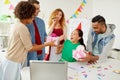 Team greeting colleague at office birthday party Royalty Free Stock Photo