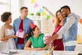 Team greeting colleague at office birthday party Royalty Free Stock Photo