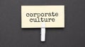 corporate culture text on paper with wihte clip. On black background