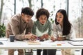 Three Diverse Young Business Professionals Brainstorming Working Together In Office Royalty Free Stock Photo