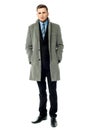 Corporate guy wearing long overcoat