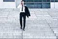 Corporate Man With Cellular Phone On Stairs Royalty Free Stock Photo