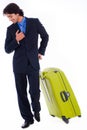 Corporate man looking down with is luggage Royalty Free Stock Photo