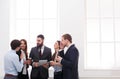 Corporate meeting of employees in office during coffee break, business people with copy space Royalty Free Stock Photo