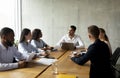 Corporate Meeting. Group Of Multiethnic Business People Having Discussion In Conference Room Royalty Free Stock Photo