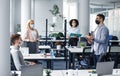 Corporate meeting in office, multiracial workers in protective masks discussion project