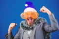 Corporate party ideas employees will love. Corporate christmas party. Man bearded hipster wear santa hat and funny Royalty Free Stock Photo