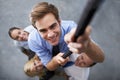 Corporate people, happy man and climbing rope for goals, target or team building exercise with staff support. Top view Royalty Free Stock Photo