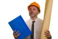 Corporate portrait of attractive and successful industrial engineer or contractor man in working hardhat holding blueprint Royalty Free Stock Photo