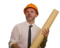 Corporate portrait of attractive and successful industrial engineer or contractor man in working hardhat holding blueprint Royalty Free Stock Photo