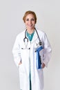 Corporate portrait of beautiful and happy woman md doctor or nurse posing smiling cheerful with stethoscope Royalty Free Stock Photo