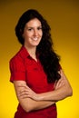 corporate portrait of a beautiful young hispanic woman with drak brown curly hair