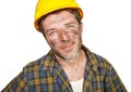 Corporate portrait of construction worker - attractive and happy builder man in safety helmet smiling confident as successful Royalty Free Stock Photo