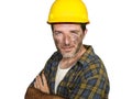 Corporate portrait of construction worker - attractive and happy builder man in safety helmet smiling confident as successful Royalty Free Stock Photo