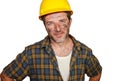 Corporate portrait of construction worker - attractive and happy builder man in safety helmet smiling confident as successful Royalty Free Stock Photo