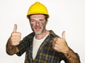 Corporate portrait of construction worker - attractive and happy builder man in safety helmet smiling confident posing relaxed as Royalty Free Stock Photo