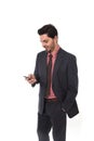 Corporate portrait of young attractive businessman of Latin Hispanic ethnicity with mobile phone Royalty Free Stock Photo