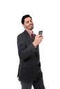 Corporate portrait of young attractive businessman of Latin Hispanic ethnicity with mobile phone Royalty Free Stock Photo