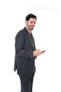 Corporate portrait of young attractive businessman of Latin Hispanic ethnicity with mobile phone Royalty Free Stock Photo