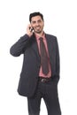 Corporate portrait of young attractive businessman of Latin Hispanic ethnicity talking on mobile phone Royalty Free Stock Photo