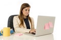 Corporate portrait young attractive businesswoman at office chair working at laptop computer desk Royalty Free Stock Photo