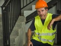 Corporate portrait of young attractive and happy builder man or constructor posing confident smiling wearing building helmet and Royalty Free Stock Photo