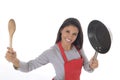 Corporate portrait of young attractive hispanic home cook woman in red apron posing happy and smiling isolated Royalty Free Stock Photo