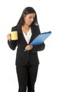Corporate portrait young attractive latin businesswoman happy holding folder and coffee Royalty Free Stock Photo
