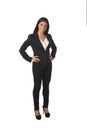 Corporate portrait of young attractive latin businesswoman in office suit smiling happy