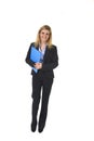 Corporate portrait young happy businesswoman holding folder posing confident smiling and relaxed Royalty Free Stock Photo