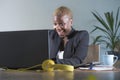 Corporate portrait of young happy and successful black afro American business woman working at modern office smiling cheerful havi Royalty Free Stock Photo