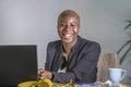 Corporate portrait of young happy and successful black afro American business woman working at modern office smiling cheerful havi Royalty Free Stock Photo