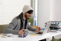 Corporate portrait young hispanic attractive hipster businessman working with computer modern home office Royalty Free Stock Photo