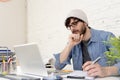 Corporate portrait of young hispanic attractive hipster businessman working at modern home office Royalty Free Stock Photo