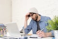 Corporate portrait of young hispanic attractive hipster businessman working at modern home office Royalty Free Stock Photo