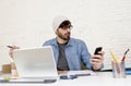 Corporate portrait of young hispanic attractive hipster businessman working at modern home office Royalty Free Stock Photo