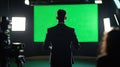 A corporate presenter giving a speech in front of a green screen Royalty Free Stock Photo