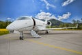 Corporate private jet - plane on runway in mountains Royalty Free Stock Photo