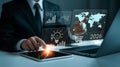 Businessman analyzing digital data on multiple screens with laptop tablet and transparent interfaces for future strategy and Royalty Free Stock Photo
