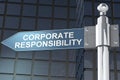 Corporate responsibility word on road sign with building as background