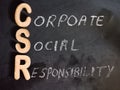 corporate social responsibility word displayed on chalkboard with wooden 3d text format Royalty Free Stock Photo