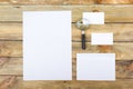 Business card. Corporate stationery set mockup. Blank textured brand ID elements on wooden table. Magnifier. Top view. Royalty Free Stock Photo