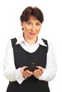 Corporate woman holding small plant in dirt