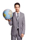 The corporate world is my oyster. A handsome young executive holding a globe while isolated on a white background. Royalty Free Stock Photo