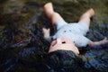 Corpse floating in dark water Royalty Free Stock Photo