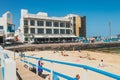 View of public beach in Corralejo with the port in the background