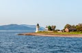 The Corran Point Lighthouse and Lodge on the Corran Narrows, in Loch Linnhe.