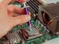 Correct application of thermal conductive paste to the cover of a computer or server circuit before installing the radiator of the